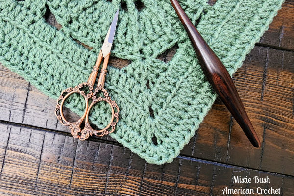 Close-up view of the Oyster Square crochet stitches, highlighting the raised texture from front and back post stitches combined with back loop ribbing.