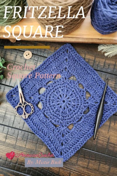 A beautifully textured 9-inch Fritzella Square crochet pattern displayed on a wooden tray with greenery, showcasing intricate stitches. Part of the Riverwood Square CAL, perfect for blankets and home décor.