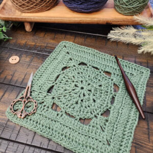 Stable Square crochet pattern – a 9-inch textured square with V-stitches, back loop only, and front post double crochet. Styled with a wooden crochet hook and scissors