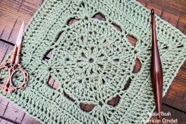 Close-up of Stable Square crochet stitches showing raised front post double crochet and open V-stitch details.